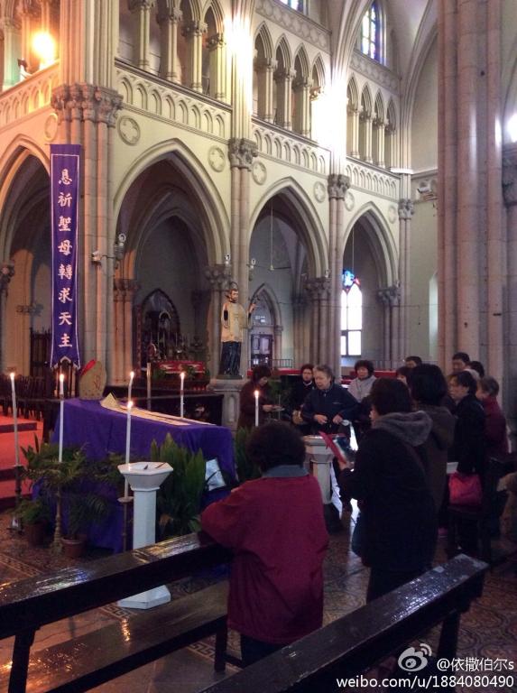 Catholics pray in Shanghai cathedral after death of Bishop Fan