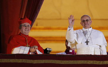 Francis waves after being announced the next pope