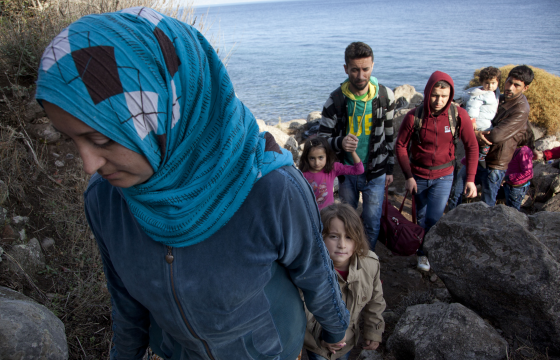 After surviving the perilous Aegean Sea crossing in a dinghy, refugees face a 44-mile hike to the camps