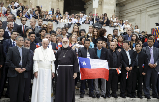 Pope Francis poses with the 33 Chilean miners who were rescued in 2010