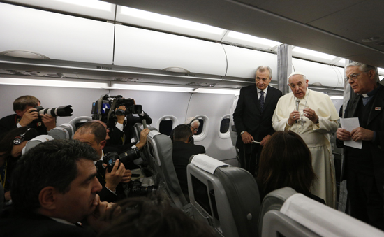 Pope Francis on papal plane back from Turkey