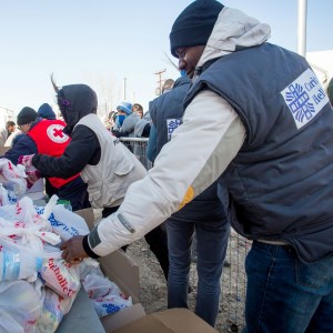 Up to 15,000 refugees on Greek-Macedonia border urgently need support, says Catholic charity