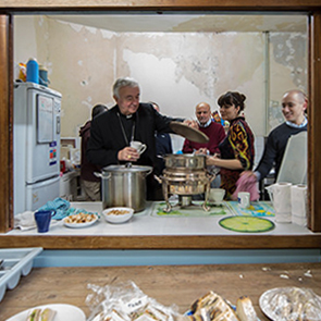 Nichols and Welby meet refugees at Catholic Worker house