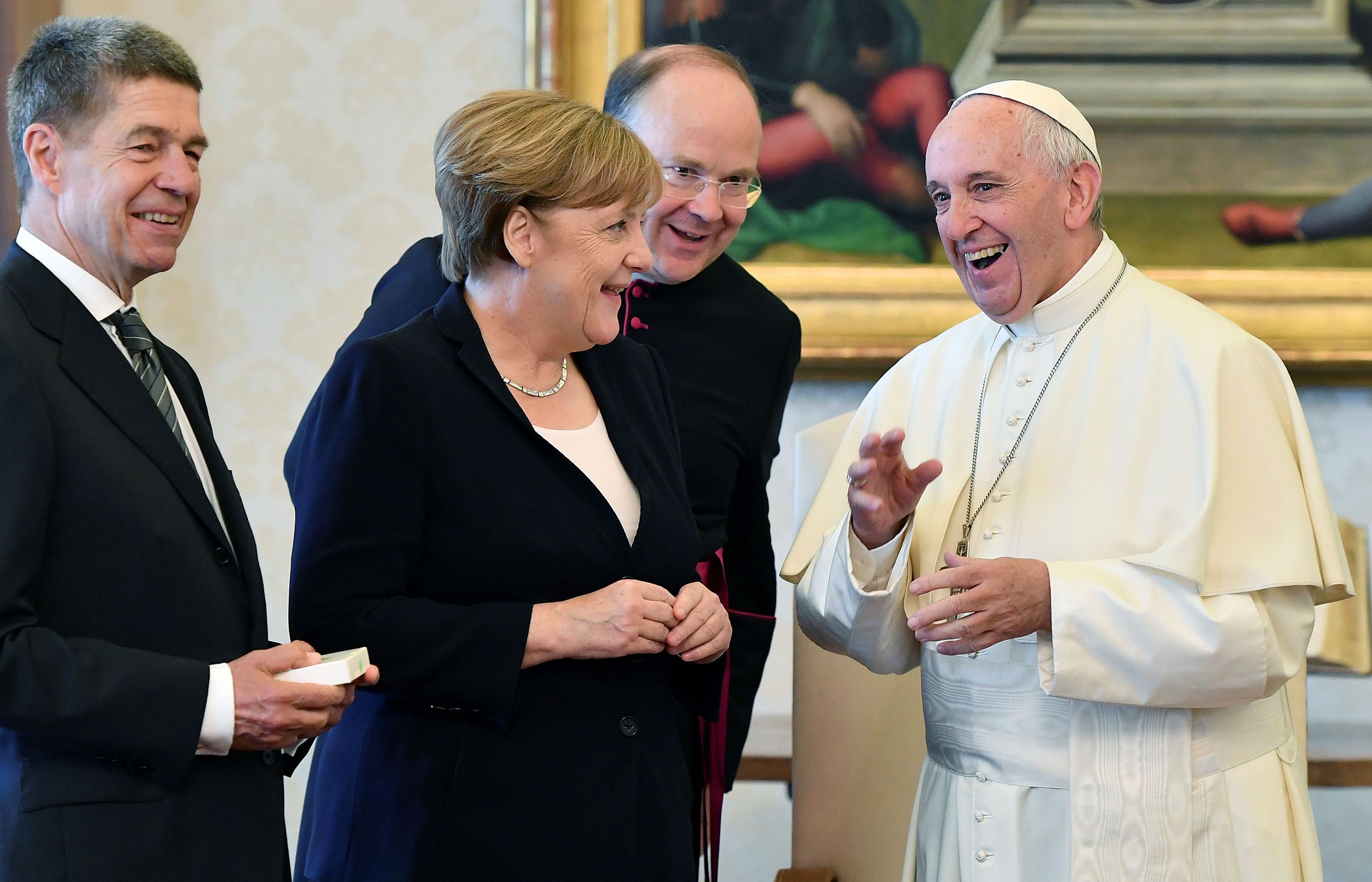 Pope urges Merkel to continue supporting Paris climate agreement