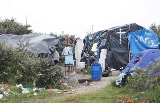 There are small clusters of safety in the Calais refugee camp, The Jungle, like a small encampment behind the Church