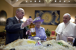 Prince Philip and the Queen hand Pope Francis whisky
