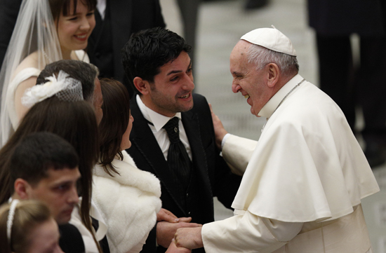 Pope blesses married couples