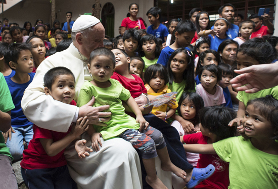 Pope meets former street children in Manila