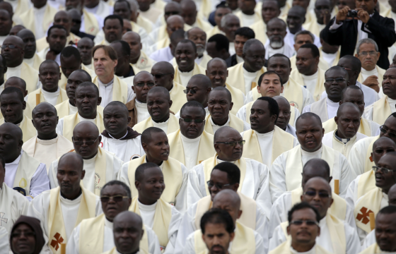 Clergy wait to see Pope Francis serve Mass in Nairobi on Wednesday