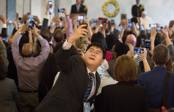 UN staff scramble to record the visit of Pope Francis