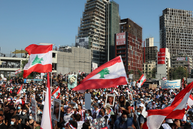 One year after explosion, Lebanon unites in grief