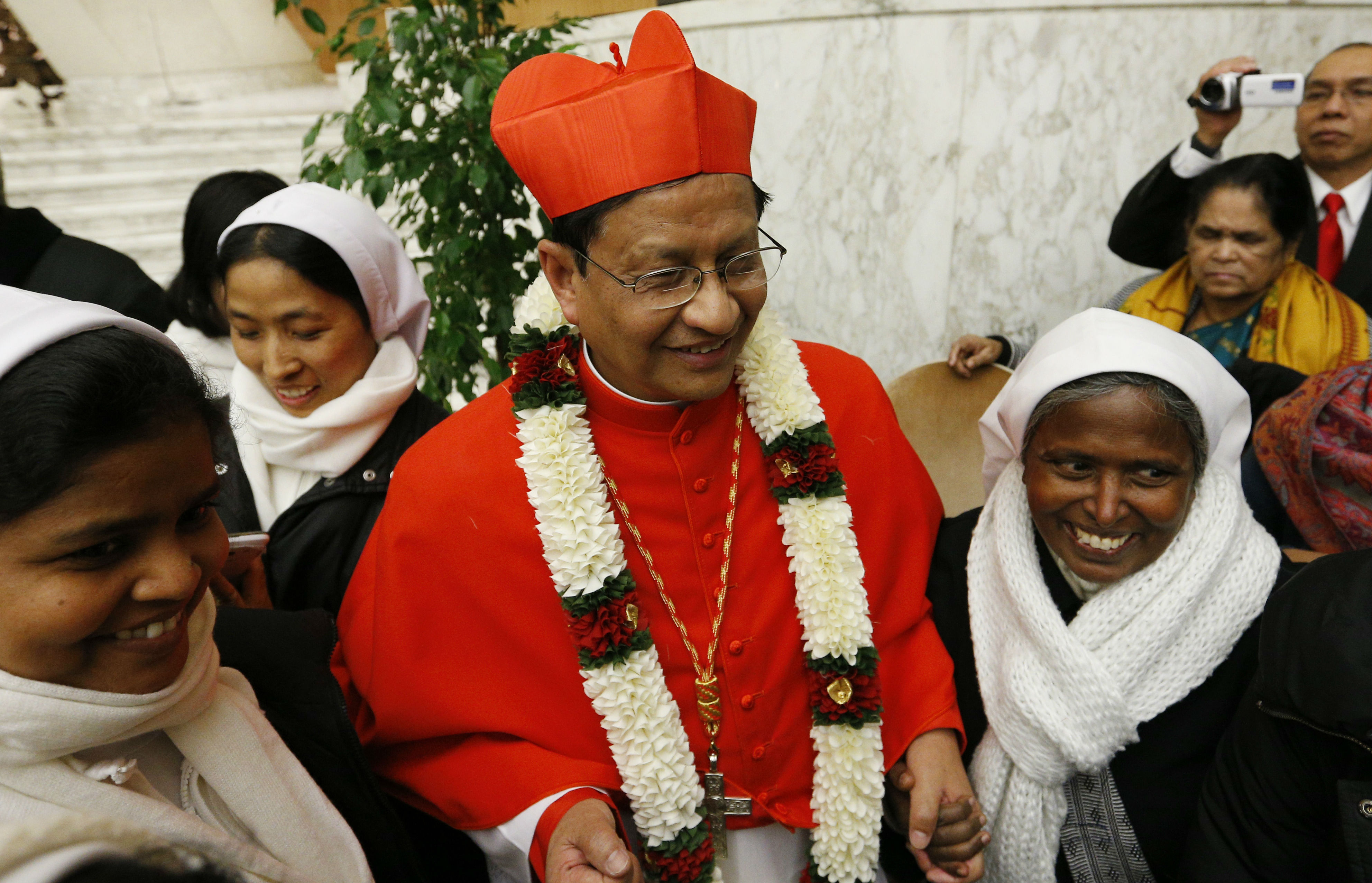 Myanmar cardinal defends country's embattled leader