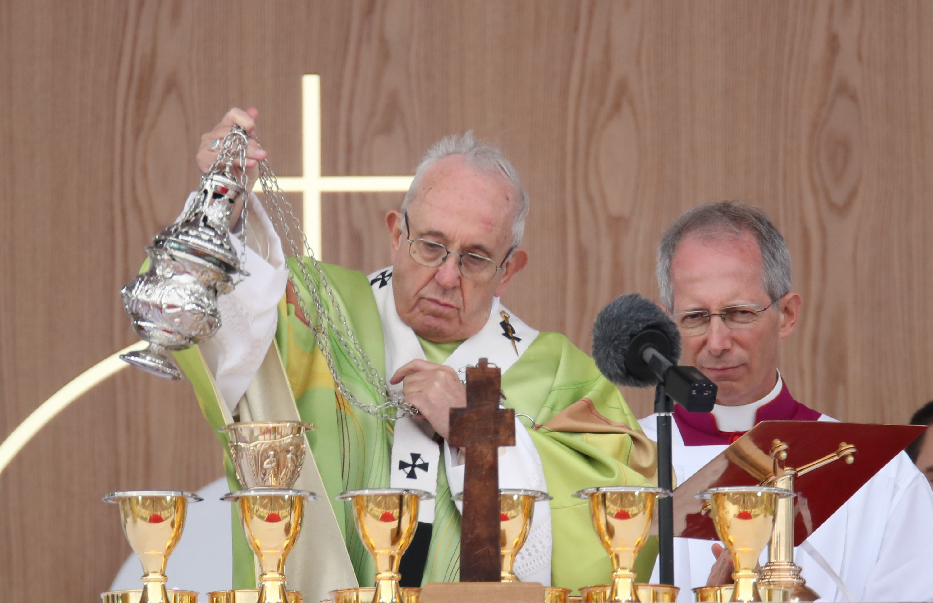 Pope offers alms amid his see of troubles
