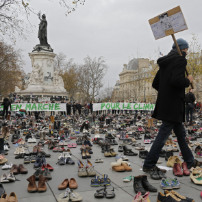 A pair of papal shoes stand in defiance of Paris authorities as Catholics demonstrate over climate change