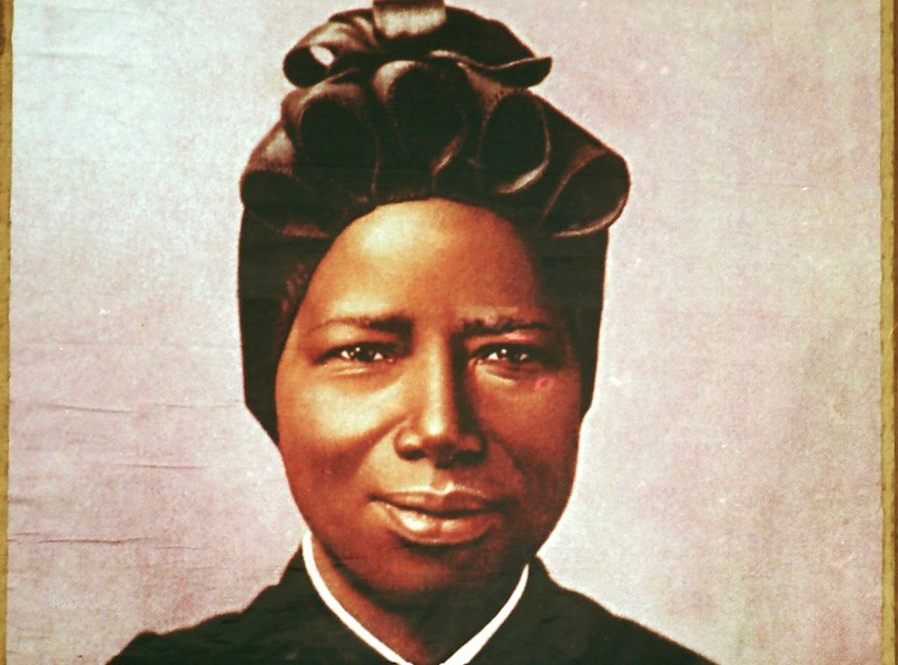 A tapestry portrait of St. Josephine Bakhita, an African slave who died in 1947, hangs from the facade of St. PeterÕs Basilica during her canonization in 2000 at the Vatican. 