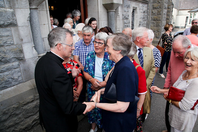 Father Michael Duignan meeting parishioners following the announcement of his appointment