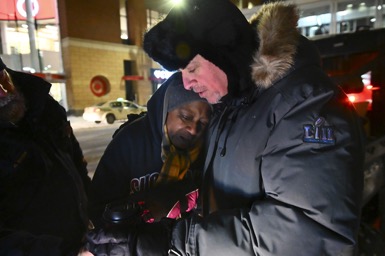Minneapolis, Minnesota, U.S. - Pastor John Steger, with Grace In The City church, embraces Jearline Cyrus, a homeless woman, in downtown Minneapolis on Tuesday night, Jan. 29, 2019 while delivering cold-weather gear, hot chocolate and food with Minneapolis Police Sgt. Grant Snyder. (Credit Image: © Aaron Lavinsky/Minneapolis Star Tribune/TNS via ZUMA Wire)