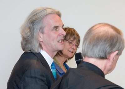 The speakers debate faith at Sarasin and